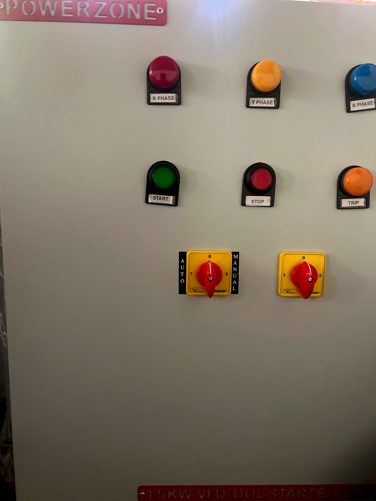 Start, stop and trip pushbuttons and selector switches on a PowerZone panel door