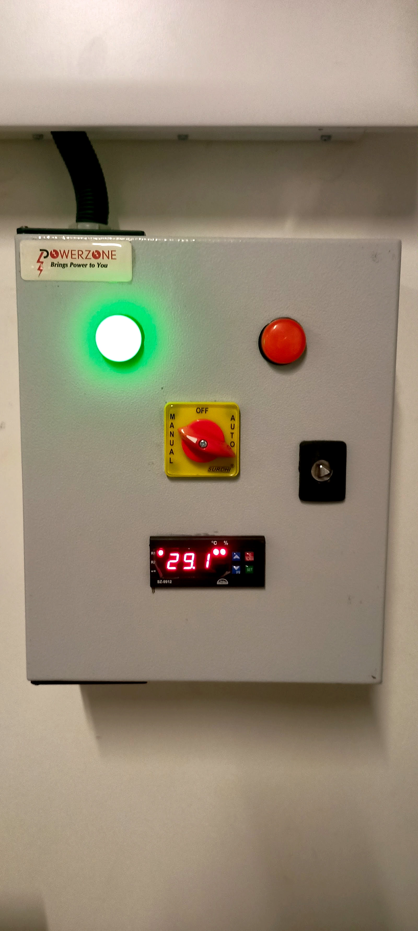 A PowerZone panel running, with the green lamp lit, an auto and manual selector and a digital readout